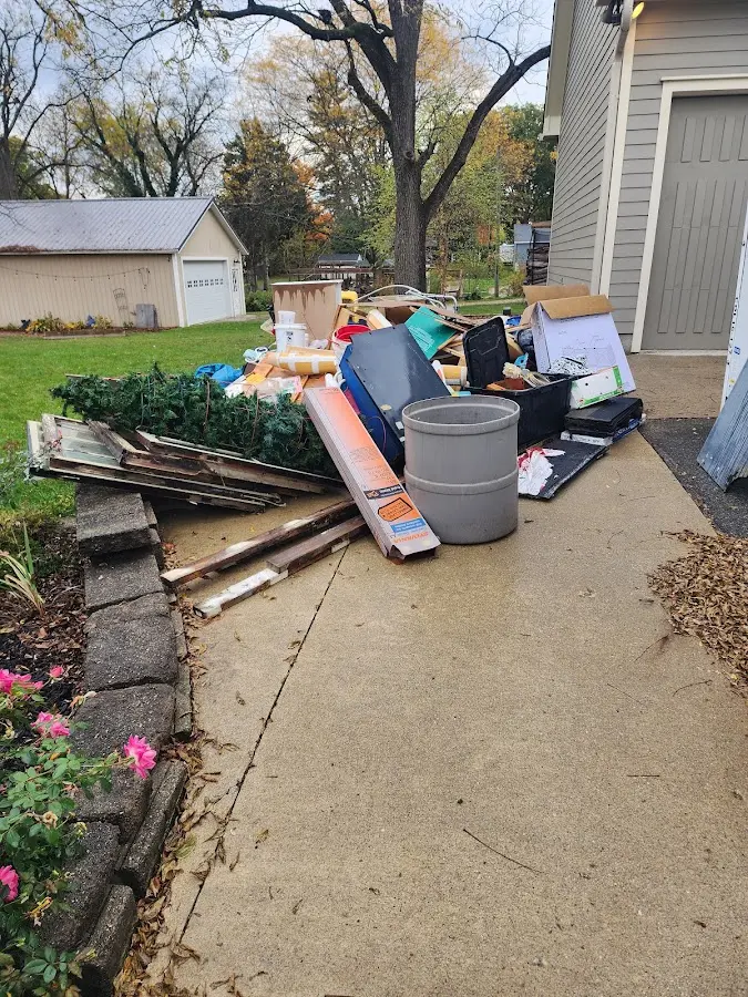 Dumpster being loaded with debris for Demolition Dumpster Rental in South Lebanon